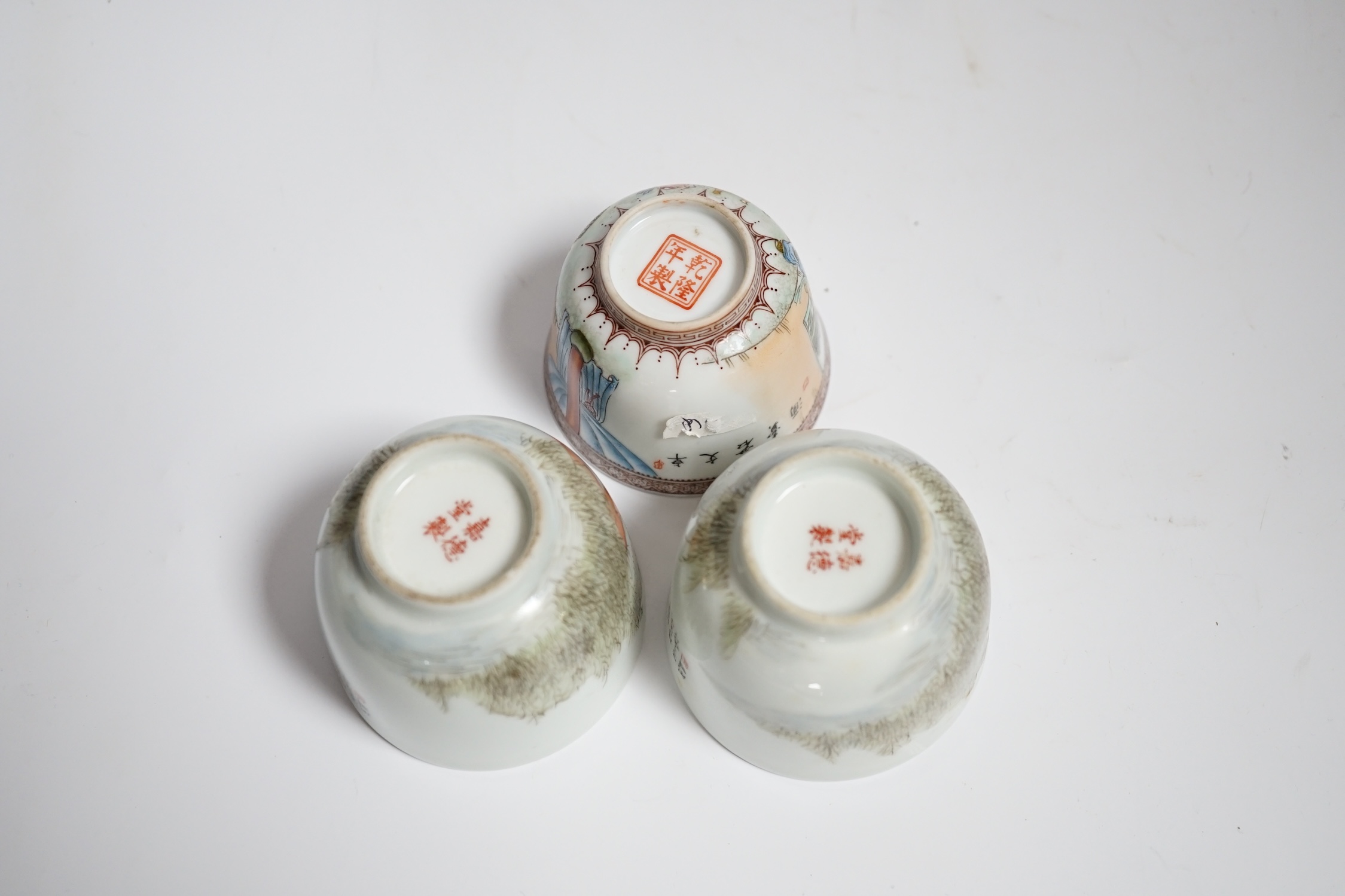Three Chinese enamelled porcelain tea bowls, largest 5cm high